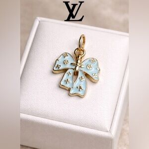 Louis Vuitton stamped  Gold and Light Blue Bow Pendant charm